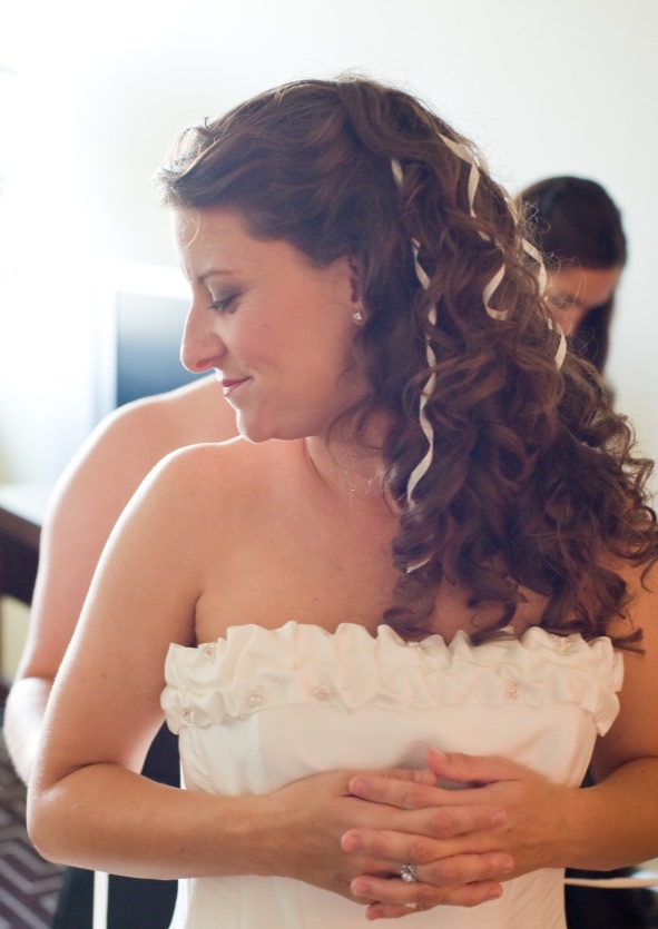 naturally curly bridal hair below the shoulders partial updo with ribbons